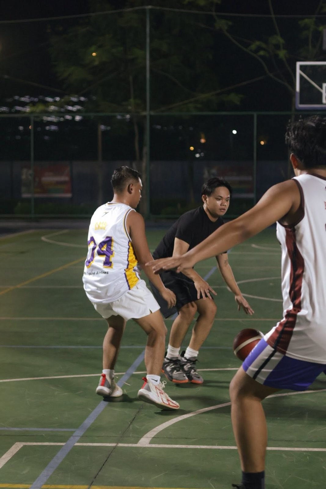 Defender guarding a ball handler at a BTC basketball run