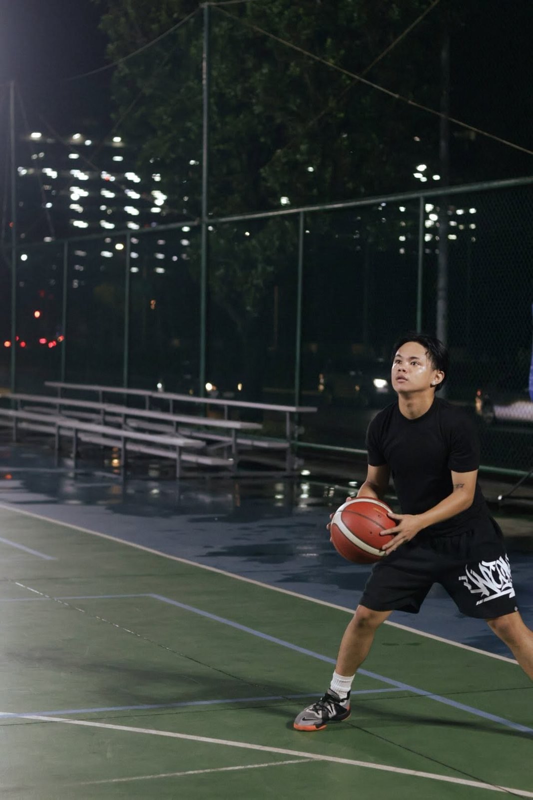 Player gripping the ball at a BTC basketball run